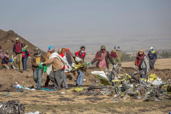 Rescuers work at the scene of an Ethiopian Airlines Boeing Max crash near Bishoftu, or Debre Zeit, south of Addis Ababa, Ethiopia, on March 11, 2019.