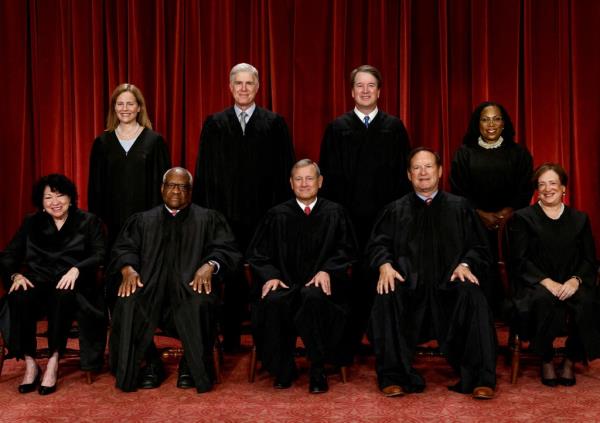 Group portrait of U.S. Supreme Court justices in black robes at the Supreme Court in Washington, U.S., October 7, 2022