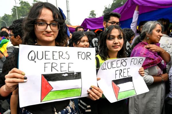 Gender rights activists and supporters of LGBTQ community express solidarity with Palestinians, as they walk the queer pride parade in New Delhi.