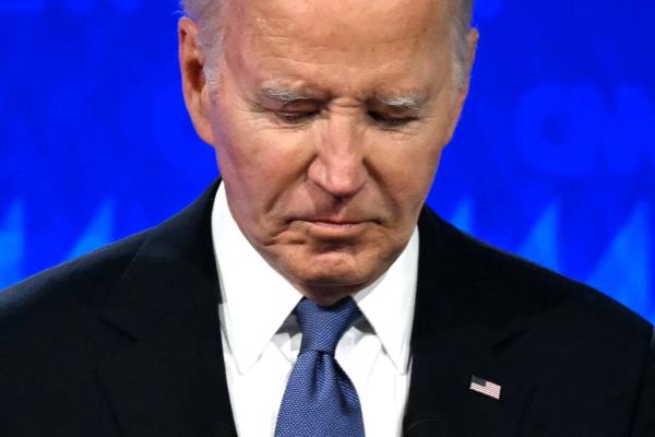 US President Joe Biden looks down as he participates in the first presidential debate of the 2024 elections with former US President and Republican presidential candidate Do<em></em>nald Trump.