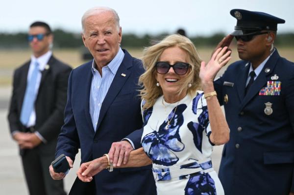 US President Joe Biden and First Lady Jill Biden step off Air Force One upon arrival at Francis S. Gabreski Airport in Westhampton Beach