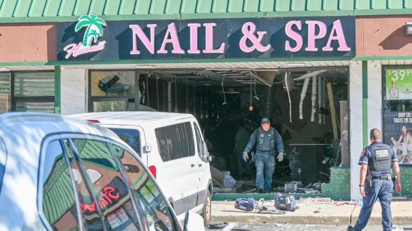 The nail salon's facade was destroyed by the car that crashed into it Friday.