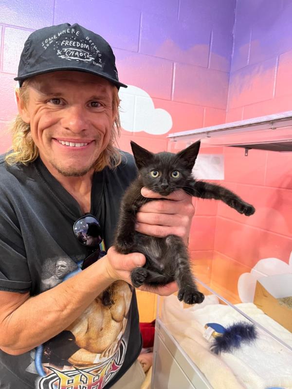 Actor Tony Cavalero, dressed in a black kitten.