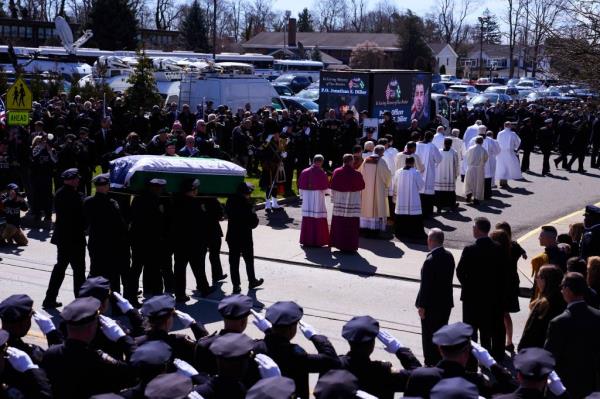 Droves of police officers from New York and elsewher<em></em>e salute Police Officer Jo<em></em>nathan Diller at his funeral service.