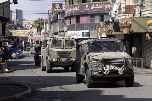 Israeli army jeeps move into the West Bank city of Nablus during a raid, Sunday, Sept. 22, 2024,(AP Photo/Majdi Mohammed).